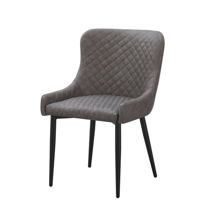 The Diamond Dining Chair features a quilted, padded gray fabric seat and backrest, slightly curved armrests, and four slender black metal legs, shown against a plain white background.