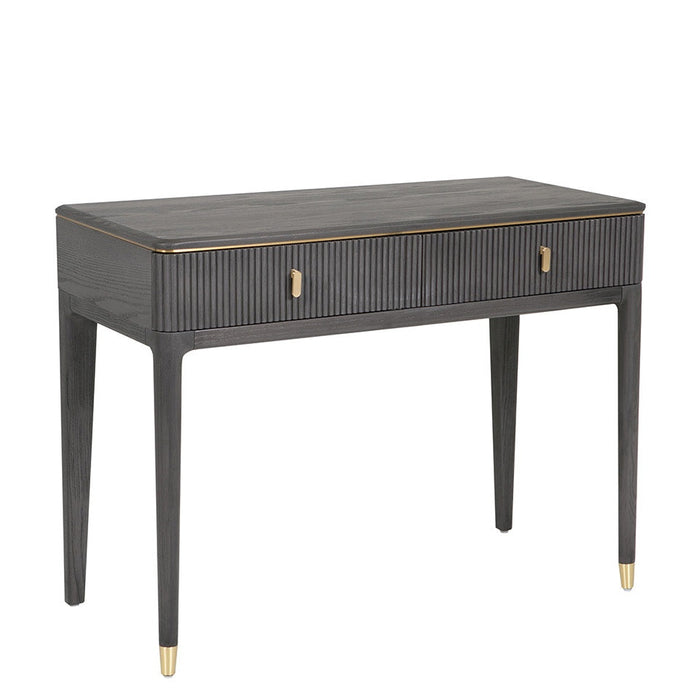 The Diletta Dressing Table features a sleek, modern design with dark wood, gold accents, slim tapered legs, ribbed front detailing, and two central drawers with gold handles—an ideal choice for stylish bedroom storage.