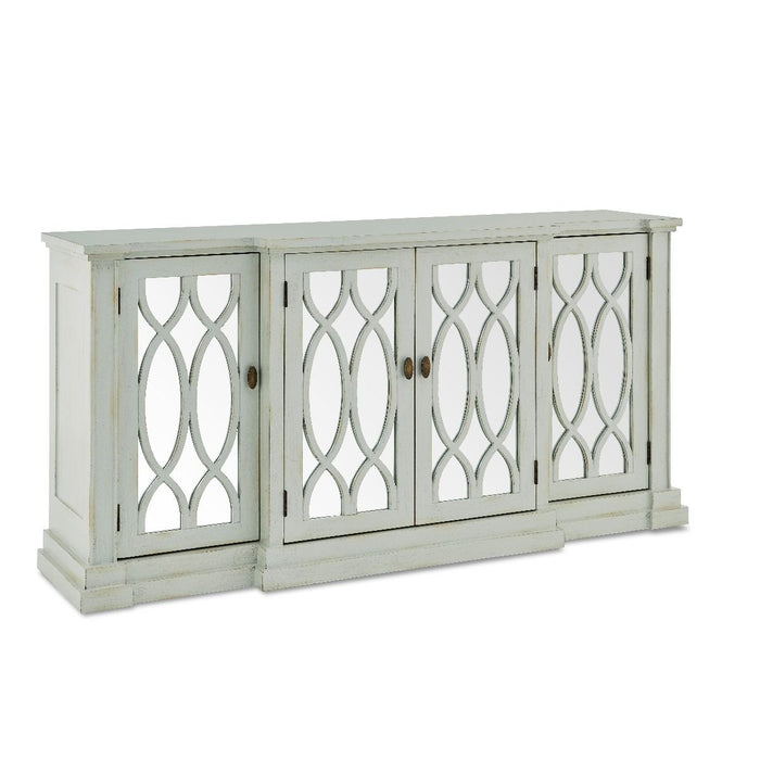 The Modena large sideboard by vendor-unknown is a white wooden piece with four cabinet doors, each adorned with mirrored glass and an oval lattice design. Its classic, elegant style features a slightly distressed finish inspired by Modena furniture.
