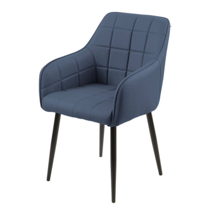 The Bianco dining chair is a modern upholstered bucket chair with dark blue quilted faux leather, four slender black legs, a curved backrest, armrests, and a stylish grid pattern on the seat and back.