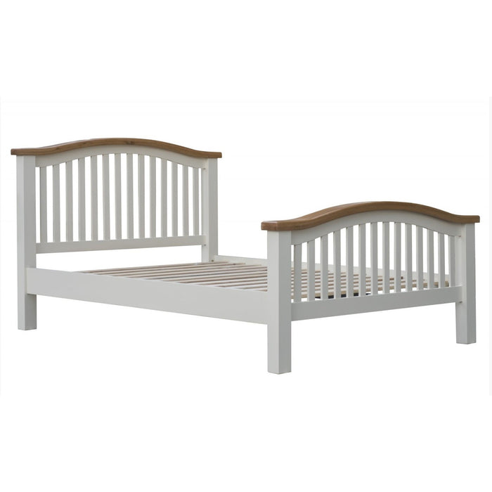The Skellig BedFrame by vendor-unknown features a white wooden frame with vertical slats and a curved natural oak top rail on the headboard and footboard, ideal for matching with oak top bedroom furniture. Mattress not included.