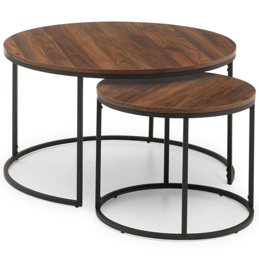 The Bellini coffee nest by vendor-unknown includes two round nesting tables with dark wood tops and black metal frames, allowing the smaller table to be partially tucked under the larger one.