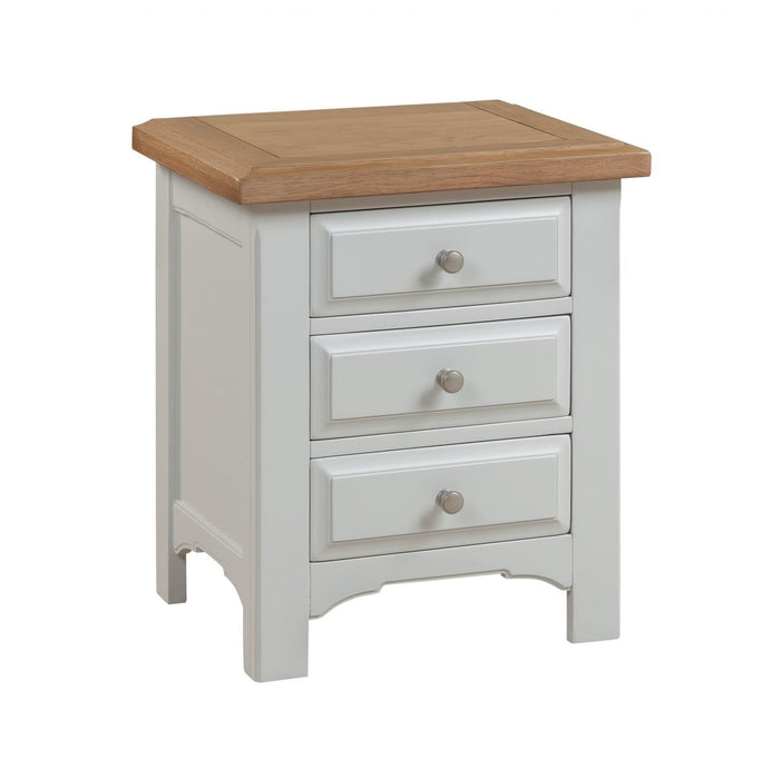 The Eden Bedside Locker by vendor-unknown features a small, light grey painted wood finish, three drawers with round metal knobs, a light brown wooden top, and a simple modern design for stylish storage.