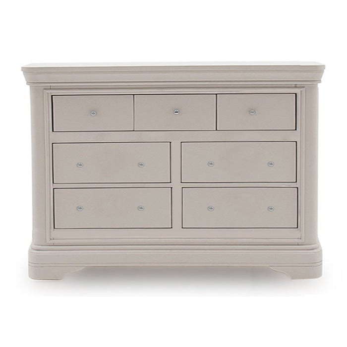 The Mabel Wide Chest by vendor-unknown features a light gray wood finish, three small top drawers, four larger lower drawers, round knobs, and a sturdy classic design that complements contemporary bed frames.