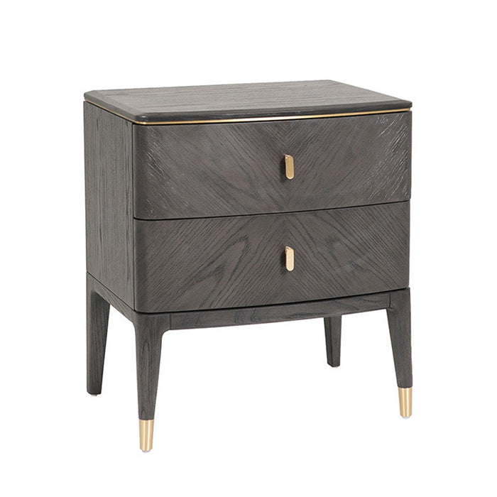 The Diletta Bedside Locker features modern ebony wood, two drawers with gold handles, gold-capped legs, a smooth finish, and rounded corners—making it a stylish addition to your bedroom furniture collection.