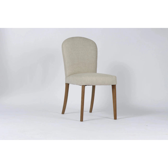The Jenny Dining Chair, featuring a beige linen seat, rounded low backrest, and wooden legs, is set against a plain white background to highlight its elegant design.