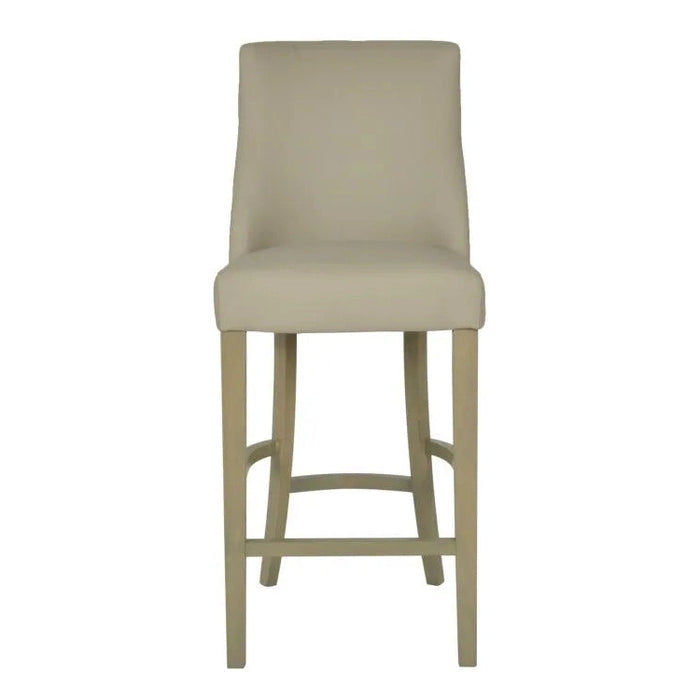 The Millie Counter Stool features a high backrest, easy-clean beige leatherette upholstery, and light wooden legs, shown from the front on a white background.
