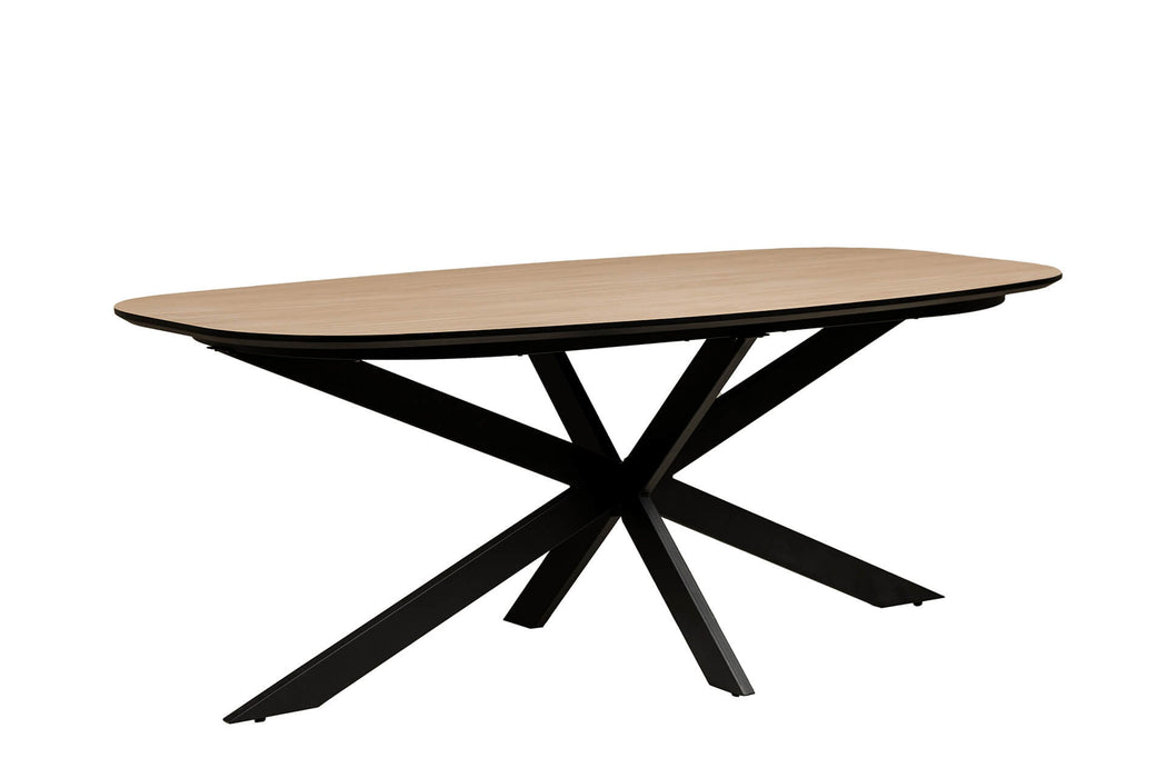The Sadie Oval Dining Table features a light wood top and black metal legs crossed in an X-shape, shown on a plain white background.
