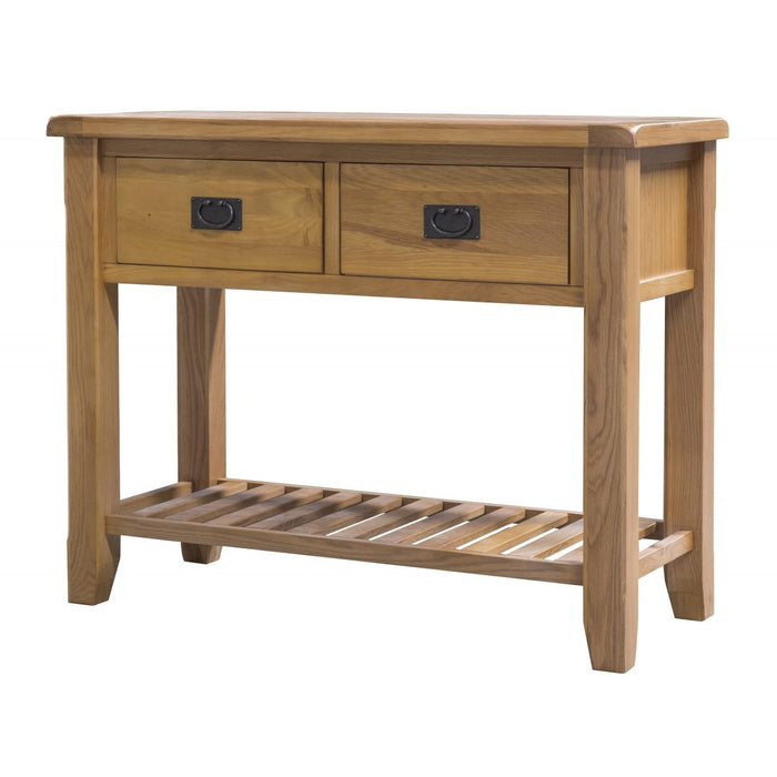The Saoirse Console Table is a handmade solid oak piece featuring two drawers with black handles and a lower slatted shelf, displayed against a white background.