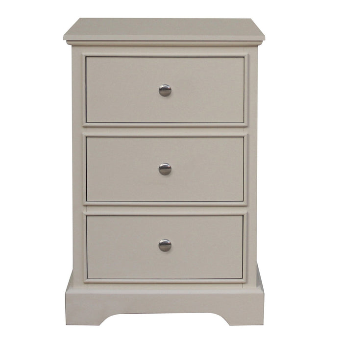 The Antique Pearl Bedside Locker is a beige wooden nightstand with three drawers, each fitted with a round metal knob. Its elegant contemporary style is highlighted by a flat base and scalloped bottom edge, adding classic charm.