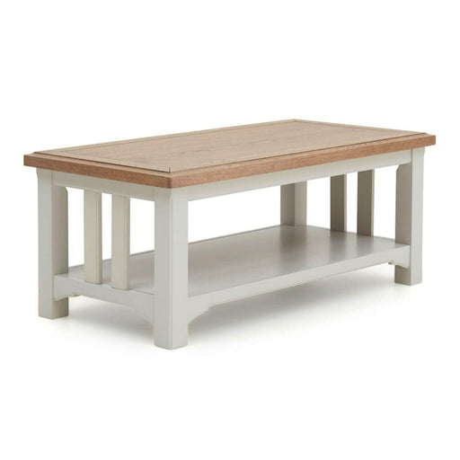 The Eden Coffee Table showcases a handcrafted solid oak top, soft grey base, slatted sides, and a lower shelf for convenient storage.