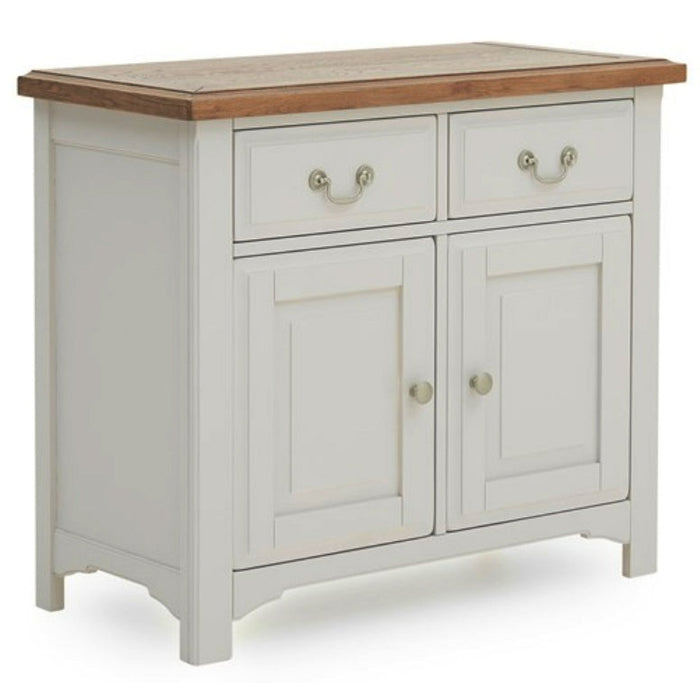 The Eden Small Sideboard features a white wooden frame, solid oak top, two drawers with metal handles, and two cabinet doors with round knobs, all supported by four sturdy legs.