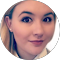 Close-up headshot of a female in a profile image.