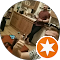 A candid indoor photo avatar with a "local guide" starburst badge.