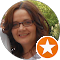 A smiling woman's headshot avatar with a Local Guide badge.
