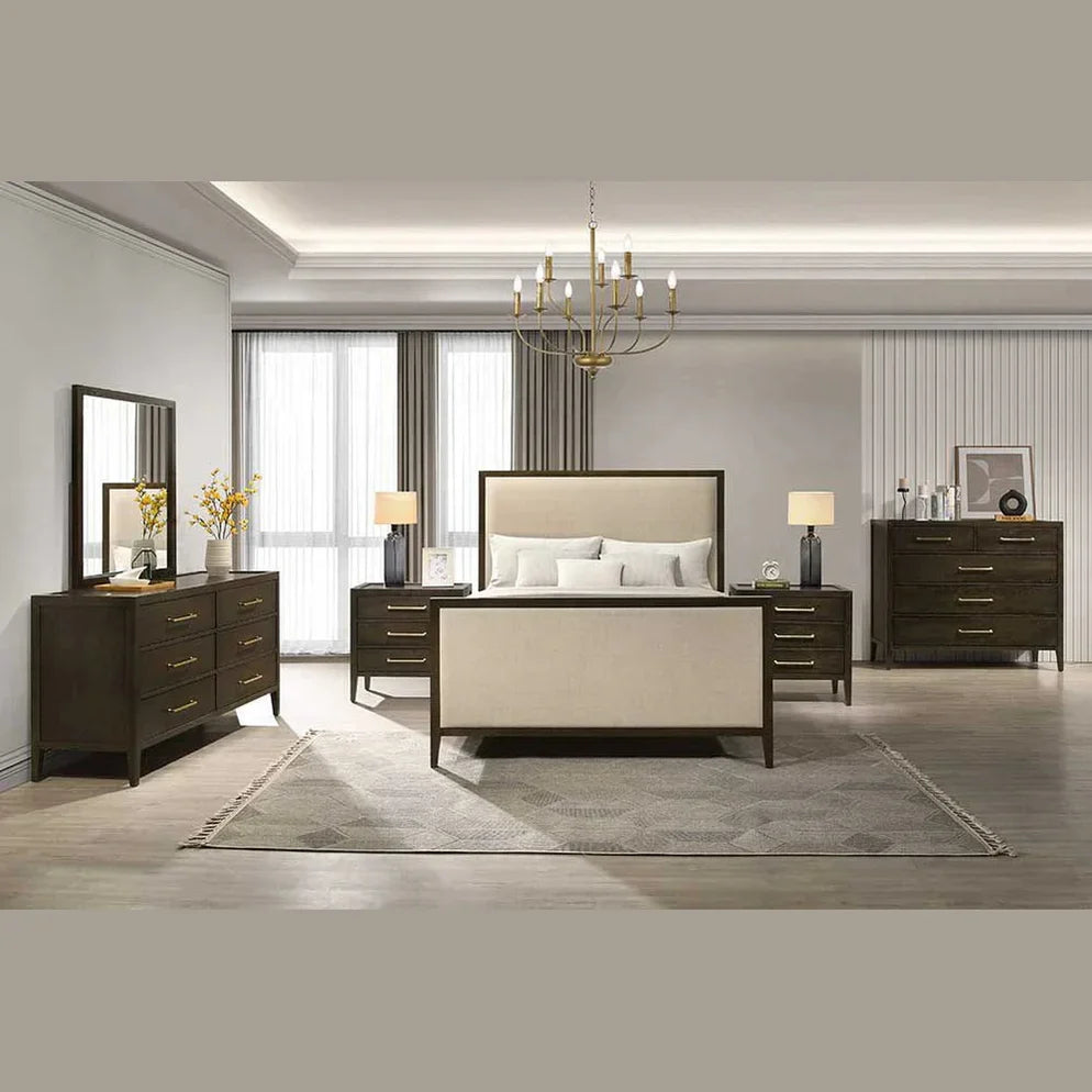 A modern bedroom with a beige upholstered bed, two nightstands with lamps, a dresser with a mirror, a chest of drawers, gray rug, and a gold chandelier, all in a neutral color palette.