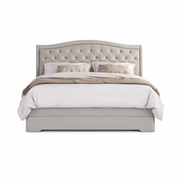 A neatly made bed with a light gray fabric headboard, white bedding, two pillows, and a throw blanket is styled on the Mabel Bedframe and viewed from the front against a white background.