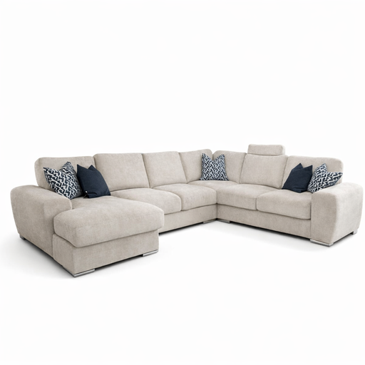 The Grand Corner Group 4L is a white modular sofa with blue pillows, featuring micro pocket springs for enhanced comfort.