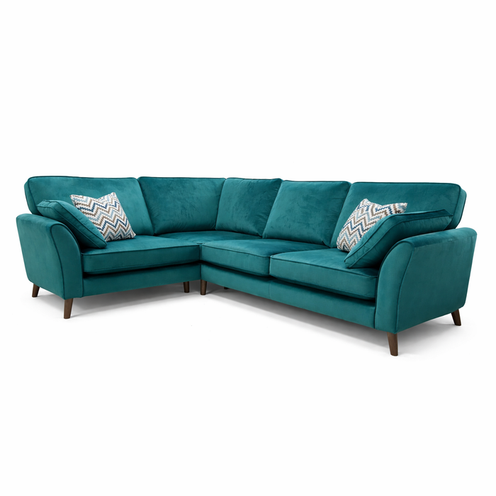 The Retro Sofa Range is a teal, L-shaped sectional with sturdy beech frames, wooden legs, and two chevron-patterned throw pillows, shown against a white background.