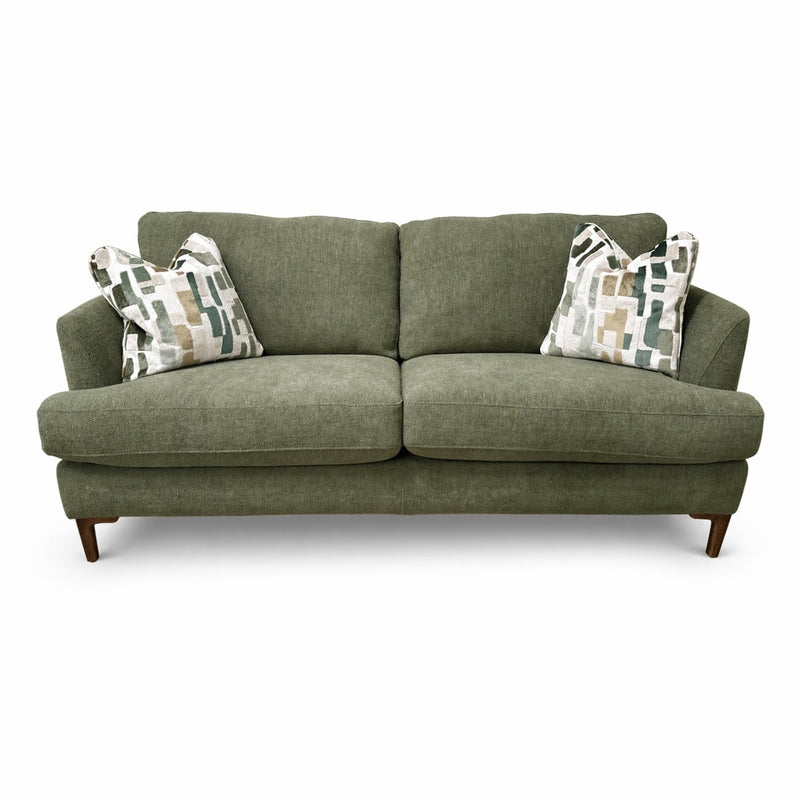 Part of the Joni Range, this contemporary green sofa features two seat and back cushions, wooden legs, plus two decorative pillows with an abstract geometric pattern in neutral tones—perfect for modern homes.