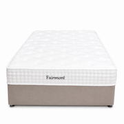 The Fairmont Mattress - Best Seller features a white quilted top, beige fabric base with casters, and "Fairmont" embroidered on the side. Shot from the front against a white background, it offers comfort and pressure relief.