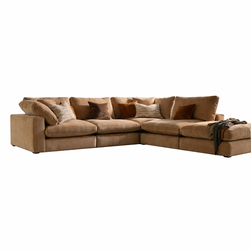 The Eden Corner Group is a large L-shaped tan sectional with deep fibre-filled seats, plush cushions, beige and brown throw pillows, and a soft blanket on one armrest. Ideal for spacious living rooms, shown against a white background.