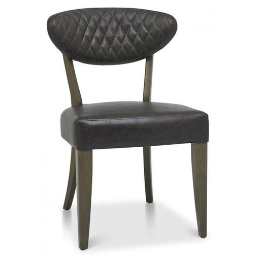 The Ellipse Fumed Oak Upholstered Chair, featuring a black diamond-patterned curved backrest, square seat, and wooden frame, complements rustic oak dining tables for a chic industrial look.