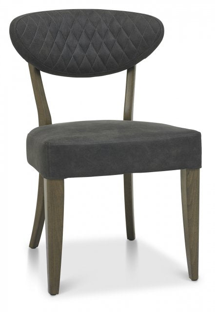 The Ellipse Fumed Oak Upholstered Chair features a quilted back, ideal for complementing industrial-style interiors or a rustic oak dining table.