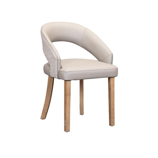 The Willow Dining Chair features a light gray cushioned seat and backrest, wooden legs, and a curved, partially open back—all set against a plain white background.