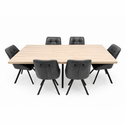 The Dalton 160cm Ext Table & 6 Pedro Chairs set features a rectangular light wood dining table with six black cushioned, metal-leg chairs with stitched backs, all displayed against a white background.