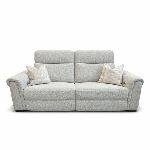 The Luna Electric Recliner is a light gray sofa with powered reclining, wide armrests, and two matching patterned cushions. Set against a white background, it combines modern style and comfortable design.
