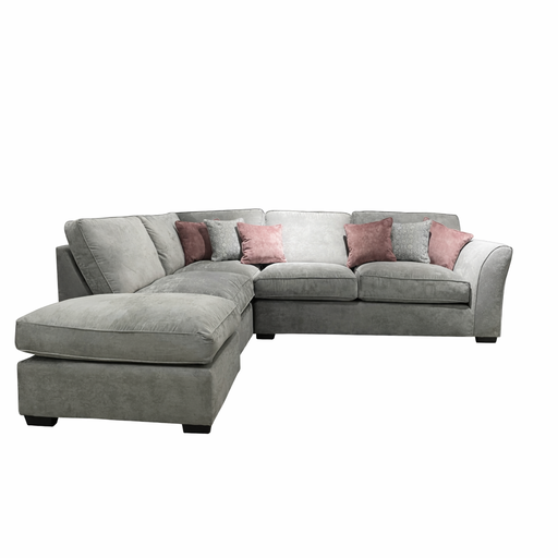 The Dorchester Corner Group is a gray L-shaped sofa with plush foam cushions and five pink accent pillows, shown on a white background.