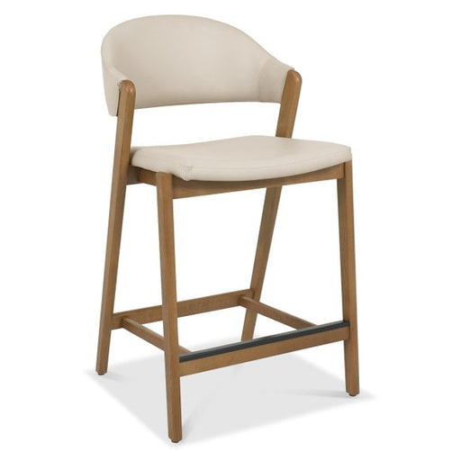 The Camden Counter Stool features a light beige upholstered seat and backrest, a curved wooden frame with legs, and a footrest, making it an ideal choice for those seeking stylish yet comfortable curved back stools.