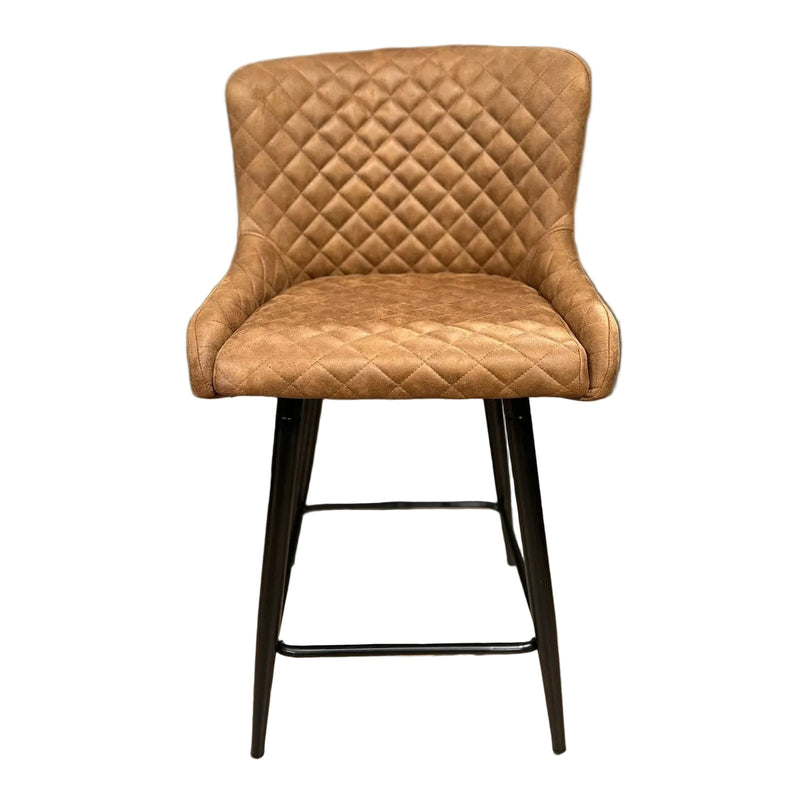 The Diamond Counter Stool features brown PU leather with diamond-patterned quilting, a curved backrest, and black metal legs—ideal as a stylish seating option for your kitchen island.