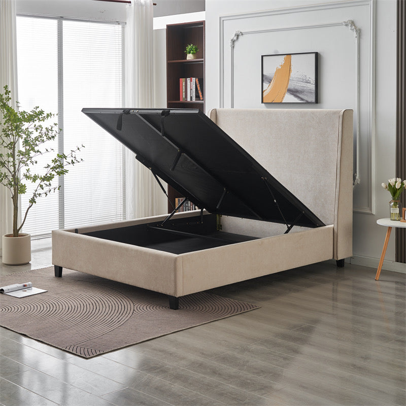 The Rivera Storage Bedframe in beige linen features a lifted mattress platform for spacious under-bed storage, making it a stylish addition to bright bedrooms with plants, rugs, bookshelves, and wall art.
