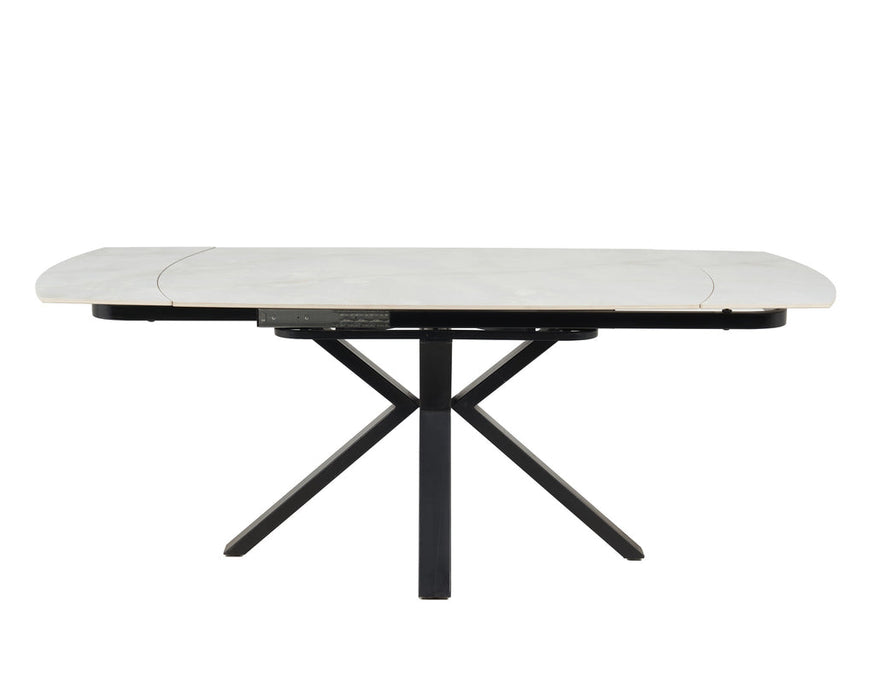 The Positano Swivel Dining Table features a modern rectangular design with X-shaped black metal legs and a sleek ceramic top, shown against a plain white background.