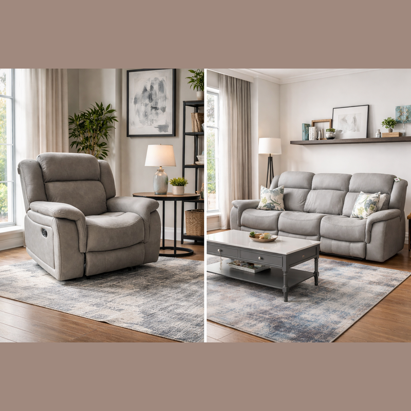 A modern living room featuring a light gray Reno Recliner Sofa in washable fabric, paired with a coffee table, floor lamp, side table, potted plant, wall art, and large windows with beige curtains on wood floors and neutral rugs.