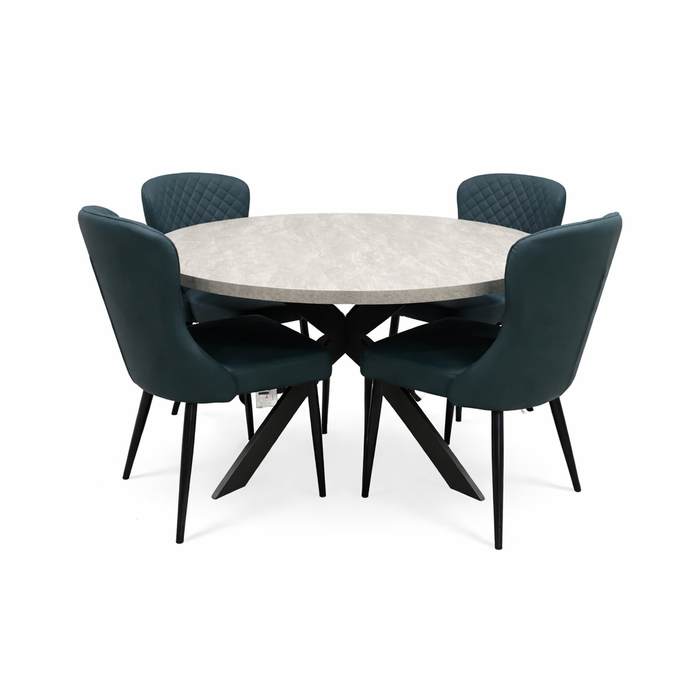The Rimini Round Extending Table, with a light stone top and black crossed legs, paired with four dark teal quilted-back upholstered chairs, adds style and efficiency to your dining space.