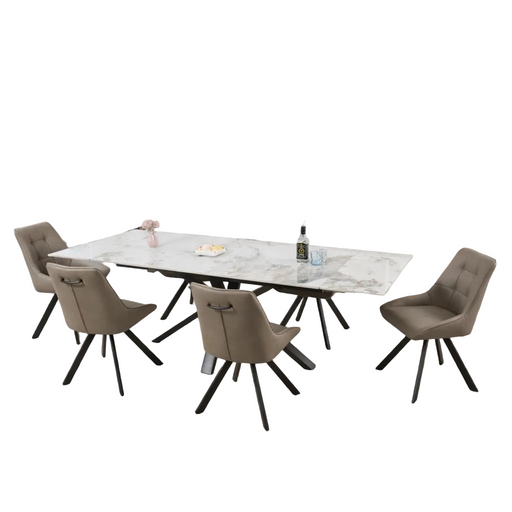 The Sorrento Dining Table with black legs is paired with six taupe Pedro Chairs, all featuring black legs. On the white-background table are a pink flower vase, a plate, and two bottles.