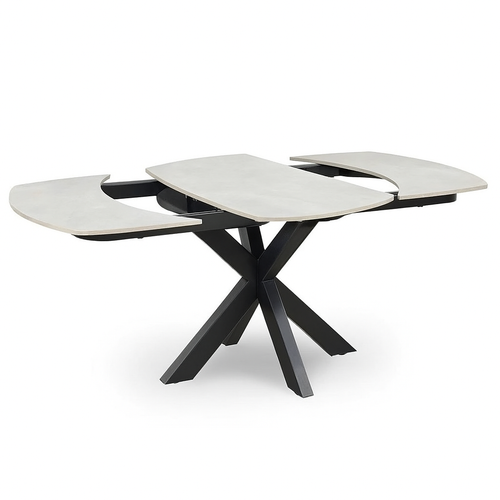 The Positano Swivel Dining Table is a modern extendable table with a light ceramic rectangular top, black metal legs, and two end sections that pull out to reveal central extension leaves.