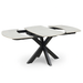 The Positano Swivel Dining Table is a modern extendable table with a light ceramic rectangular top, black metal legs, and two end sections that pull out to reveal central extension leaves.