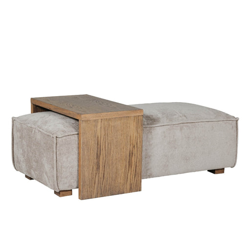 A beige upholstered ottoman and coffee table with a wooden frame, positioned against a white background.