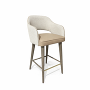 The Turim Counter Stool features a modern design with a light beige cushioned seat, curved backrest with patterned upholstery, and four wooden legs joined by metal footrests.