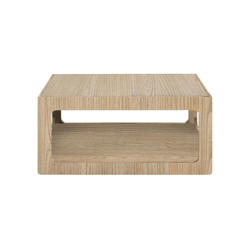 The Dakota Coffee Table – Oak is a square, minimalist coffee table crafted from light oak wood with an open shelf beneath the tabletop, shown against a white background.