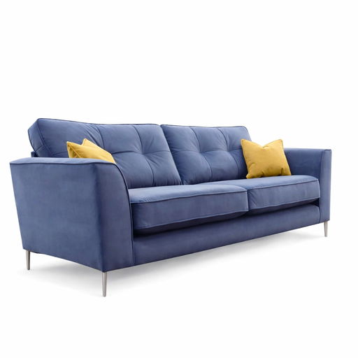 The Turino is a modern blue sofa with tufted cushions, slim metal legs, and two yellow accent pillows on a white background. Irish-made using durable Aquaclean fabric for easy care and lasting style.