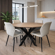 The Elson Round Table and 4 Lyra Chairs set, featuring black X legs and stylish seating, delivers a sleek, contemporary look to your dining space.