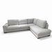The Sorrento Chaise Corner is a modern light gray L-shaped sectional sofa featuring plush cushions and low, wide arms for spacious seating, set against a white background.