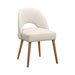 The Florence Dining Chair boasts light beige upholstery, an open lower backrest, and four wooden legs, making it a stylish modern addition to any contemporary space. Displayed on a plain white background.