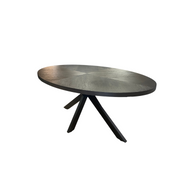 Round metallic table with black legs on a white background.