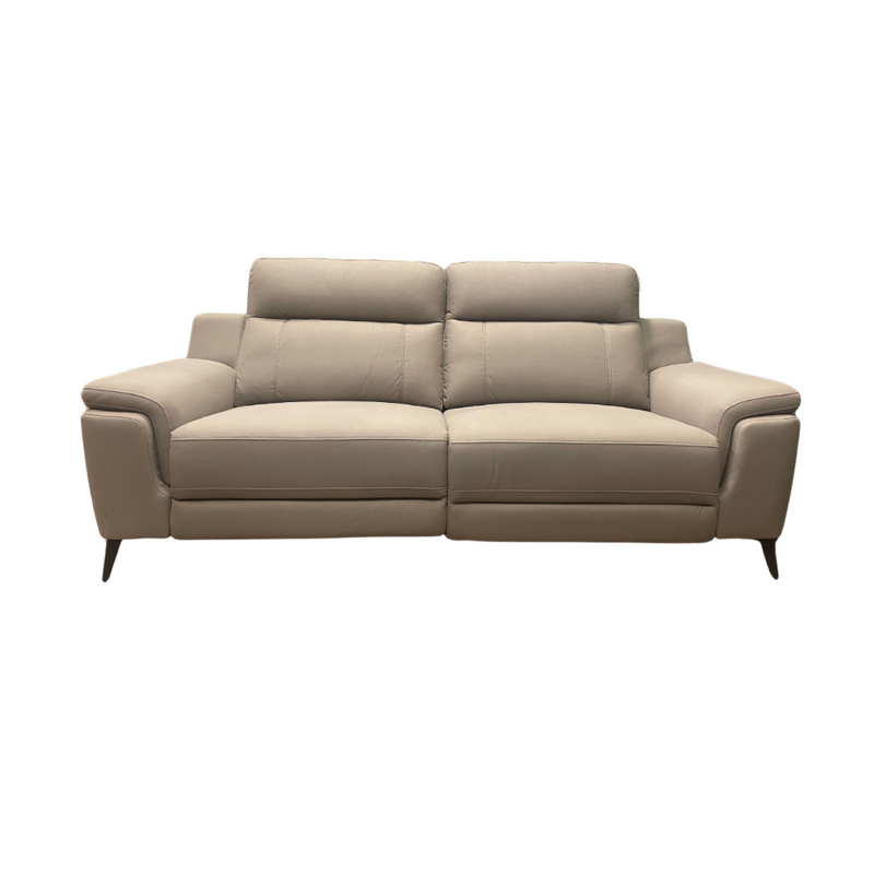 A front-facing view of the Chloe Electric Recliner, a modern contemporary sofa in beige leather featuring wide armrests, two seat cushions, and two back cushions, set against a white background.